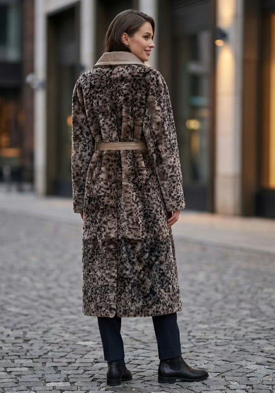 Women's sheepskin coat with leopard print in taupe and sand, worn outdoors from the back