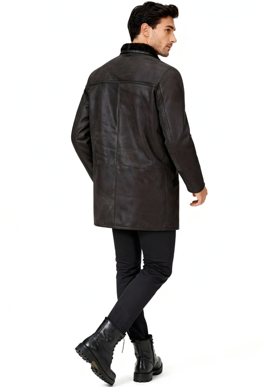 Brown men's sheepskin coat worn from the back with a straight cut and sheepskin collar