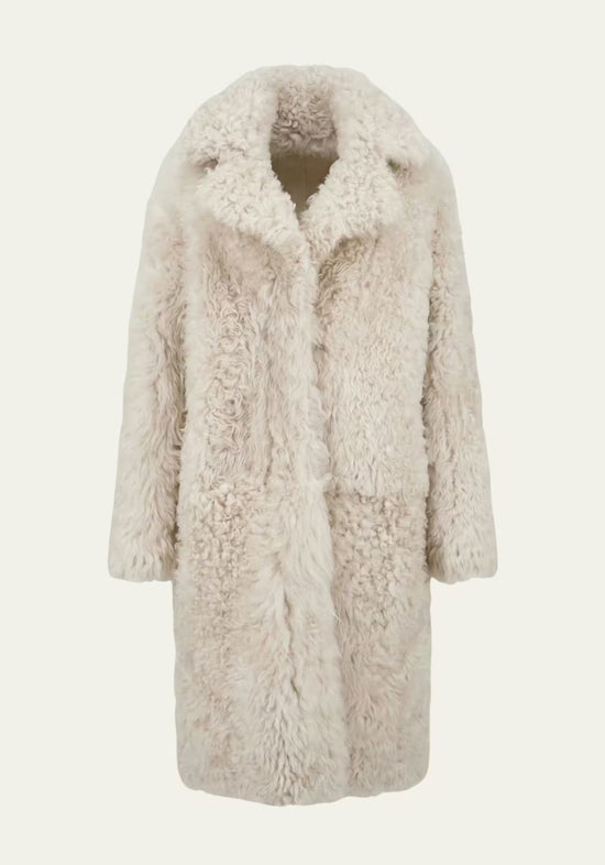 Sheepskin coat made from curly sheepskin in cream-beige, front view, cut out on a plain background.