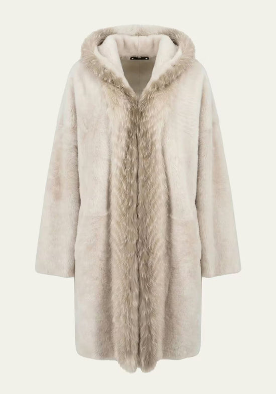 Cream women’s sheepskin coat shown from the front with hood and wide fur trim.