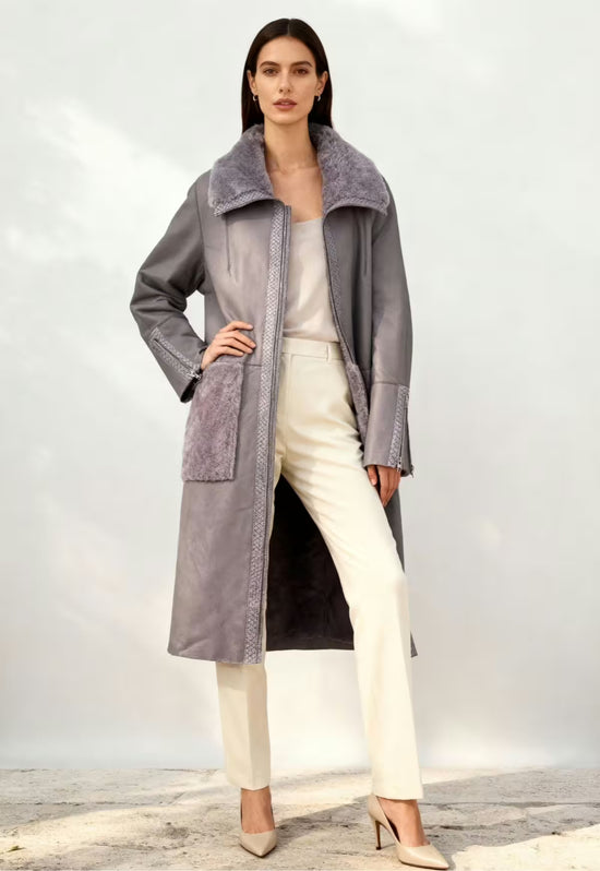 Grey women's sheepskin coat worn open with lamb nappa leather side and patch pockets