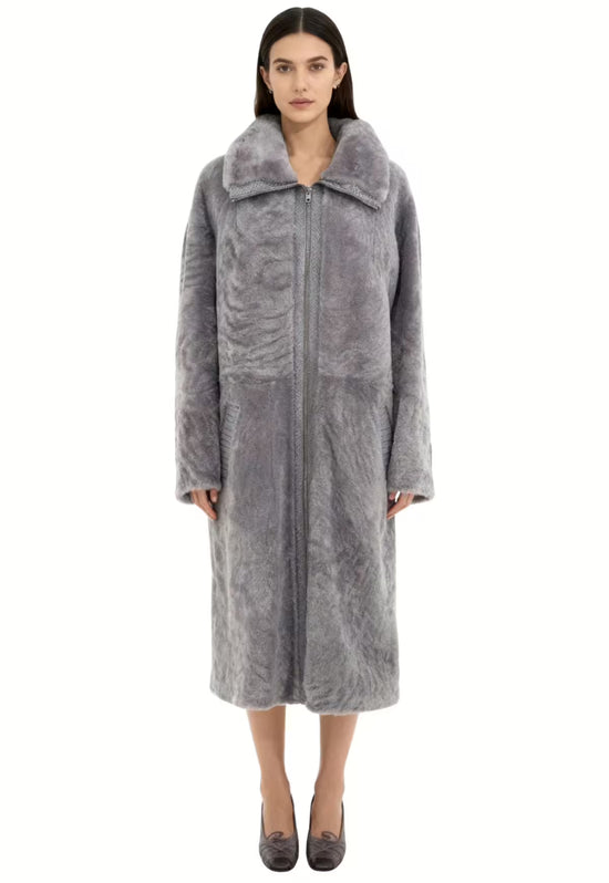 Grey women's sheepskin coat in curly sheepskin shown from the front on a model