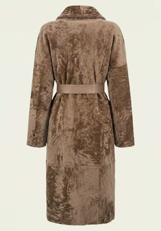 Back view of the women’s shearling sheepskin coat in cappuccino with belt