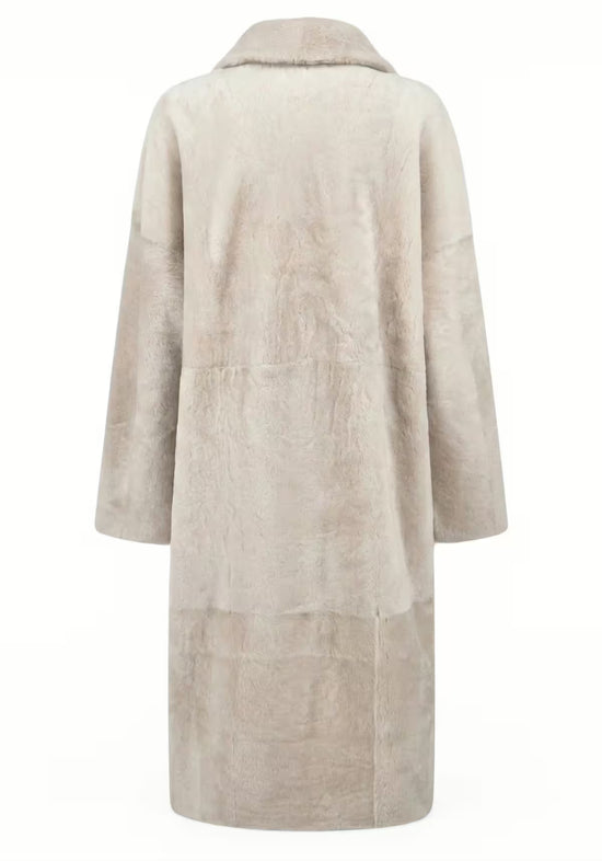 Back view of the cream shearling sheepskin coat with a smooth surface.