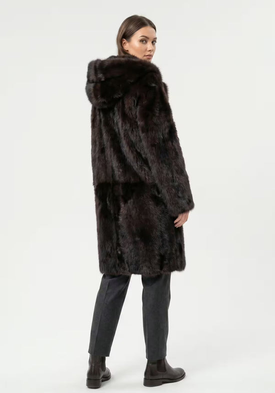Brown Toscana sheepskin coat for women worn by a model in side view.