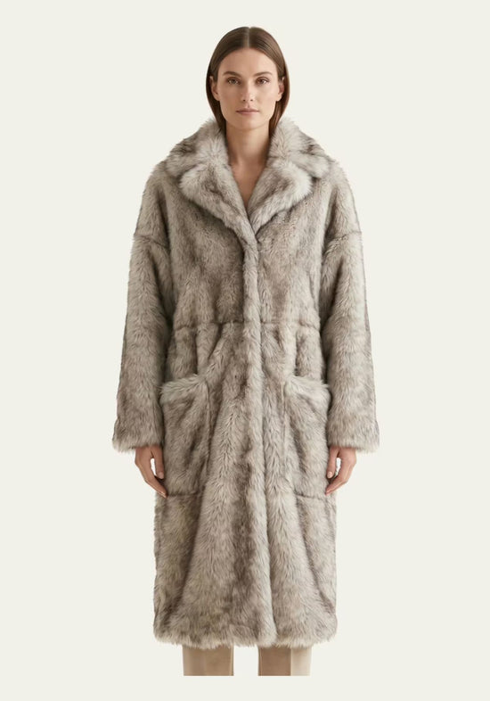 Women’s sheepskin coat made of Toscana sheepskin in frost grey, worn from the front with large pockets.