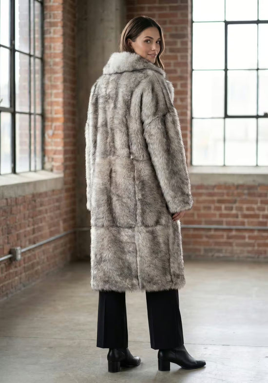 Sheepskin coat made of Toscana sheepskin in frost grey, worn from the back indoors.