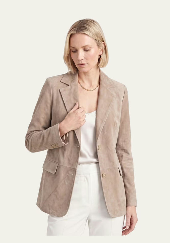 Beige women’s leather blazer in suede, worn open with a soft, relaxed drape.
