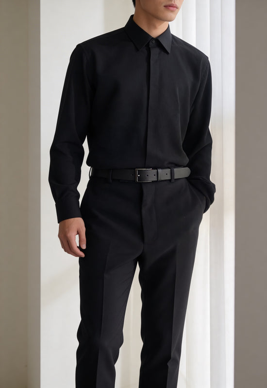 Black leather belt made from buffalo leather worn with a black men's outfit