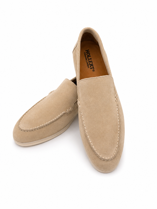 Beige men's loafers in calf suede shown at an angle with the open entry visible.