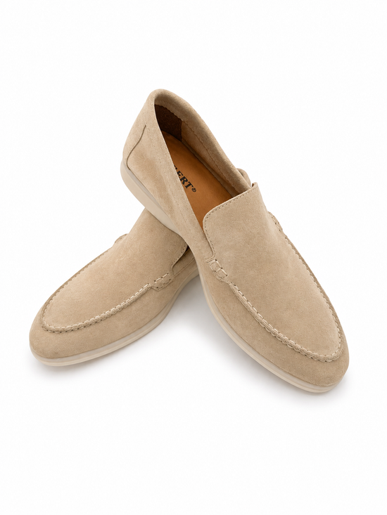 Beige men's loafers in calf suede shown crossed in a front view on a white background.