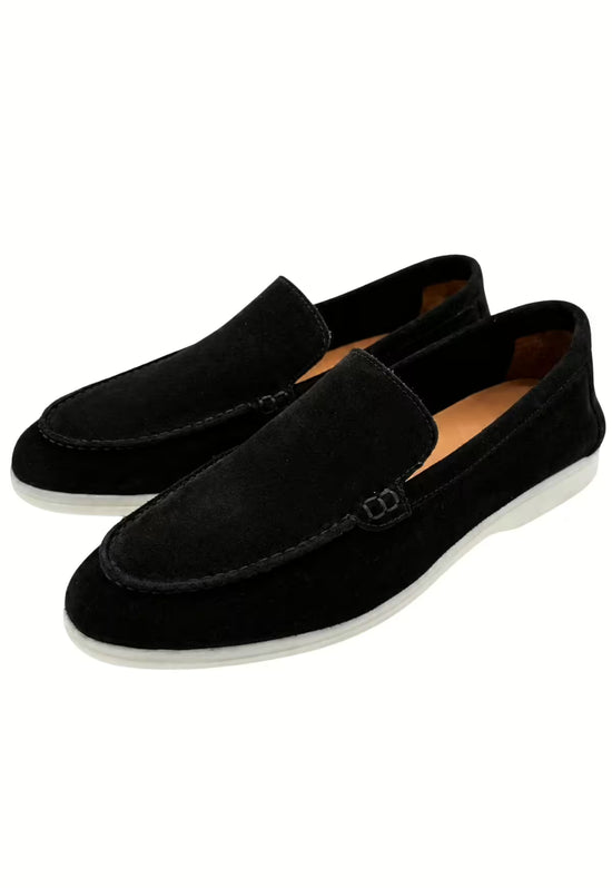 Two black men’s loafers in leather, shown at an angled view with a light sole