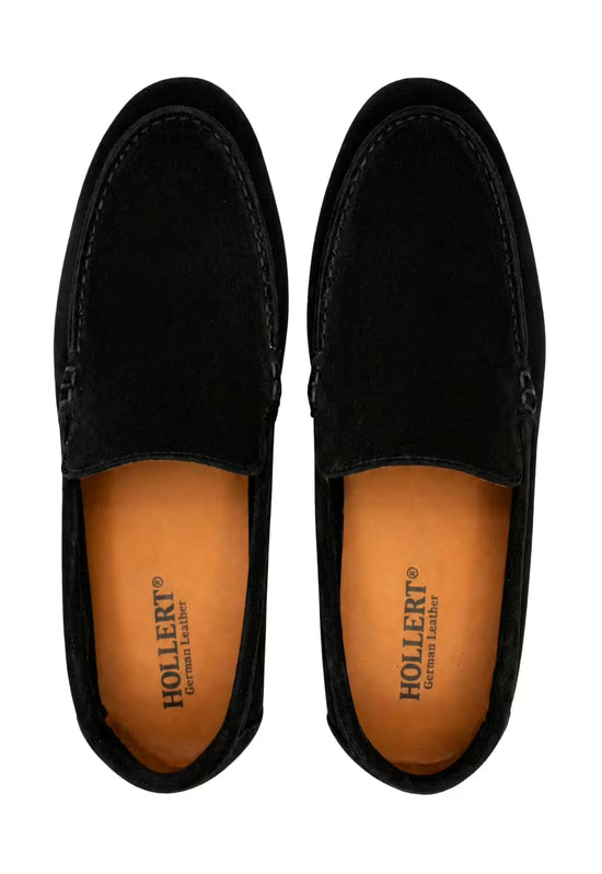 Pair of black men’s loafers in leather, viewed from above with brown lining