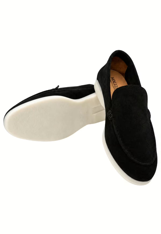 Black men’s loafers in leather, shown from below with a light outsole
