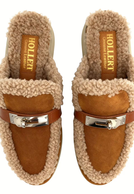 Brown women's sheepskin mules seen from above with shearling trim, buckle and lining.