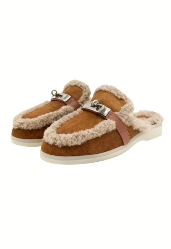 Brown women's sheepskin mules shown as a pair in an angled view with open heel.