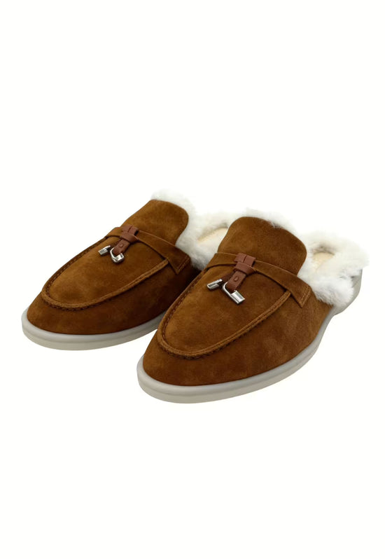 Brown ladies' sheepskin mules in an angled view, with soft upper and white fur trim.