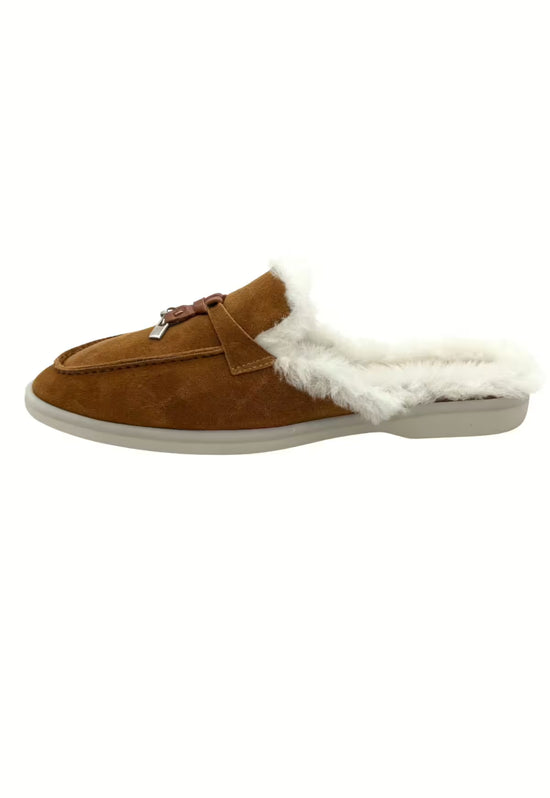 Brown ladies' sheepskin mules shown from the side with white fur trim and flat sole.