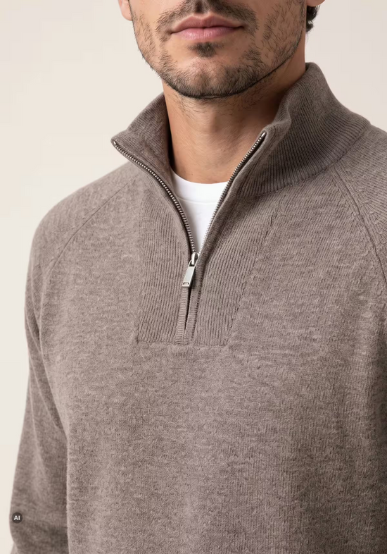 Close-up of the men's merino wool pullover in taupe, showing the zip at the stand-up collar and knit texture.
