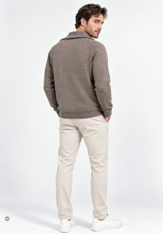 Men's merino wool pullover in taupe, worn on a model from the back with ribbed cuffs and a straight hem.