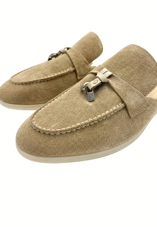 Men's suede slippers in beige with a close-up of the tassel detail.