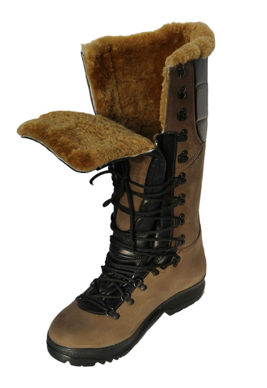 Brown sheepskin hiking boots with turned-down shaft and visible shearling lining in an angled view.