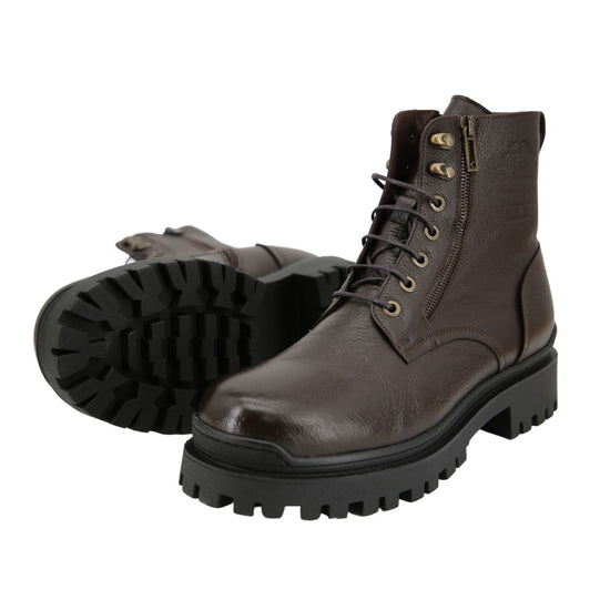 Brown sheepskin men's street shoe with a visible tread sole in a view from below and slight angle.