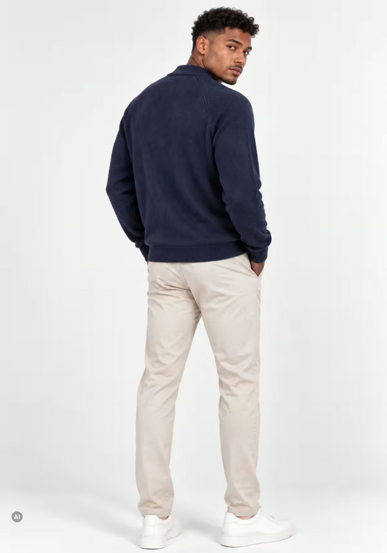 Men's merino wool cardigan in dark blue, shown from the back on the model.
