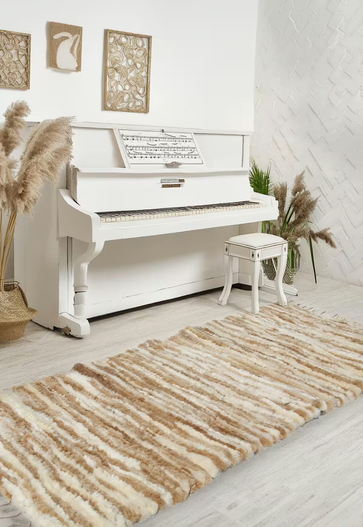 Honey-coloured wool runner in front of a white piano in a bright living room.