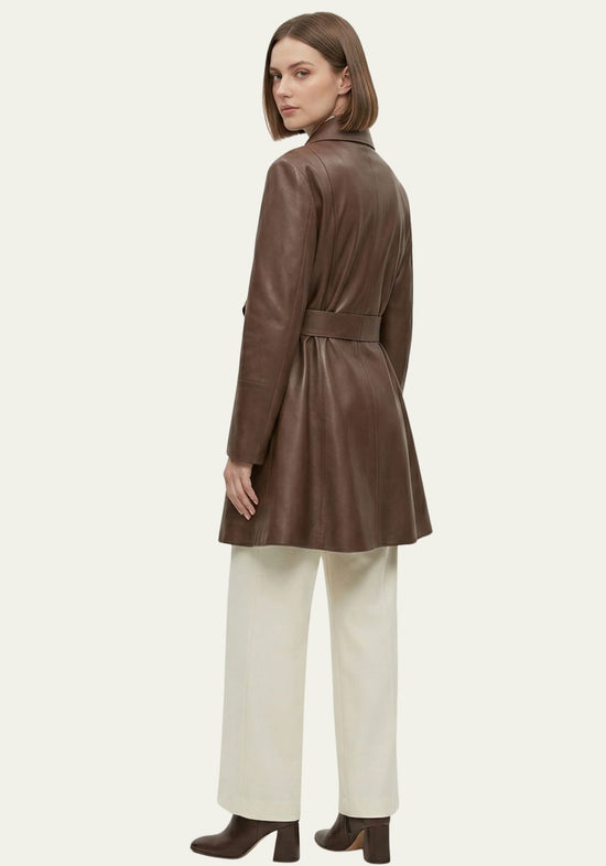 Side and back view of a brown women’s trench coat in lamb nappa leather with a belt at the back.