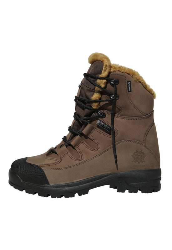Brown sheepskin hiking boot with black sole and lacing, shown from the side.