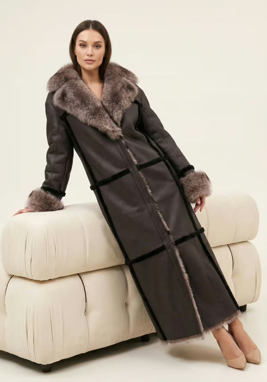 Reversible women’s sheepskin coat in espresso, shown from the side with the dark leather side and fur trim.