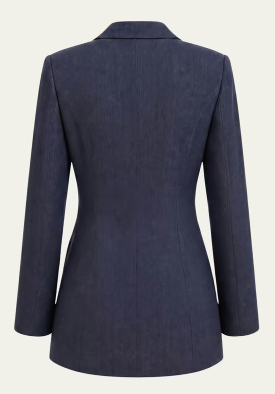 Back view of the women’s linen wrap blazer in blue with a fitted shape and long sleeves.