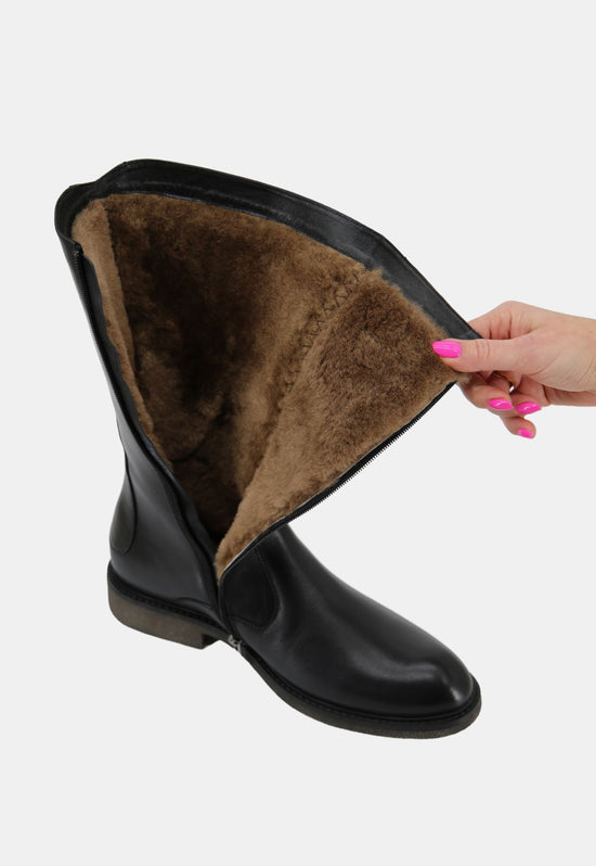 Open black sheepskin men's winter boot with the brown lining visible inside.