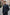 Men's wool coat in cashmere and wool, dark blue, worn at a slight angle on the street.